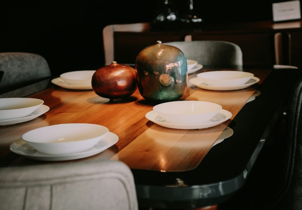 A family table set with empty plates.